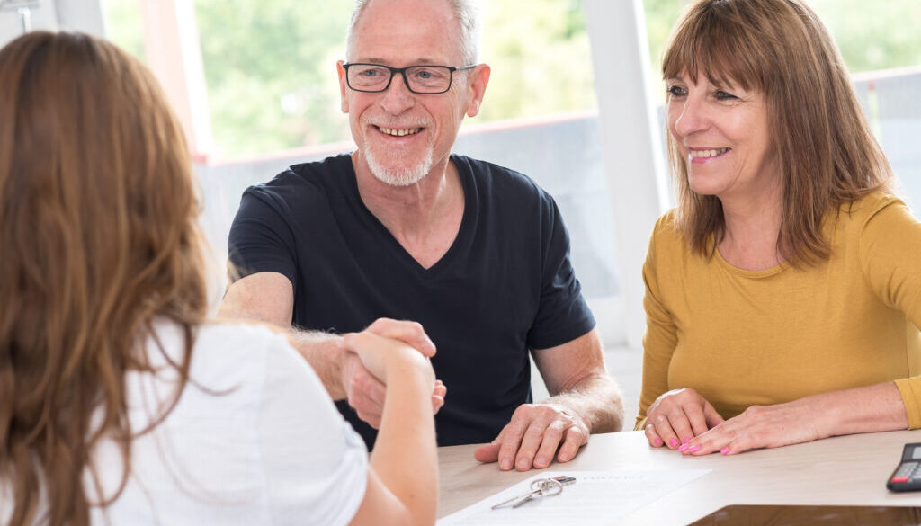 Senior couple meeting real estate agent