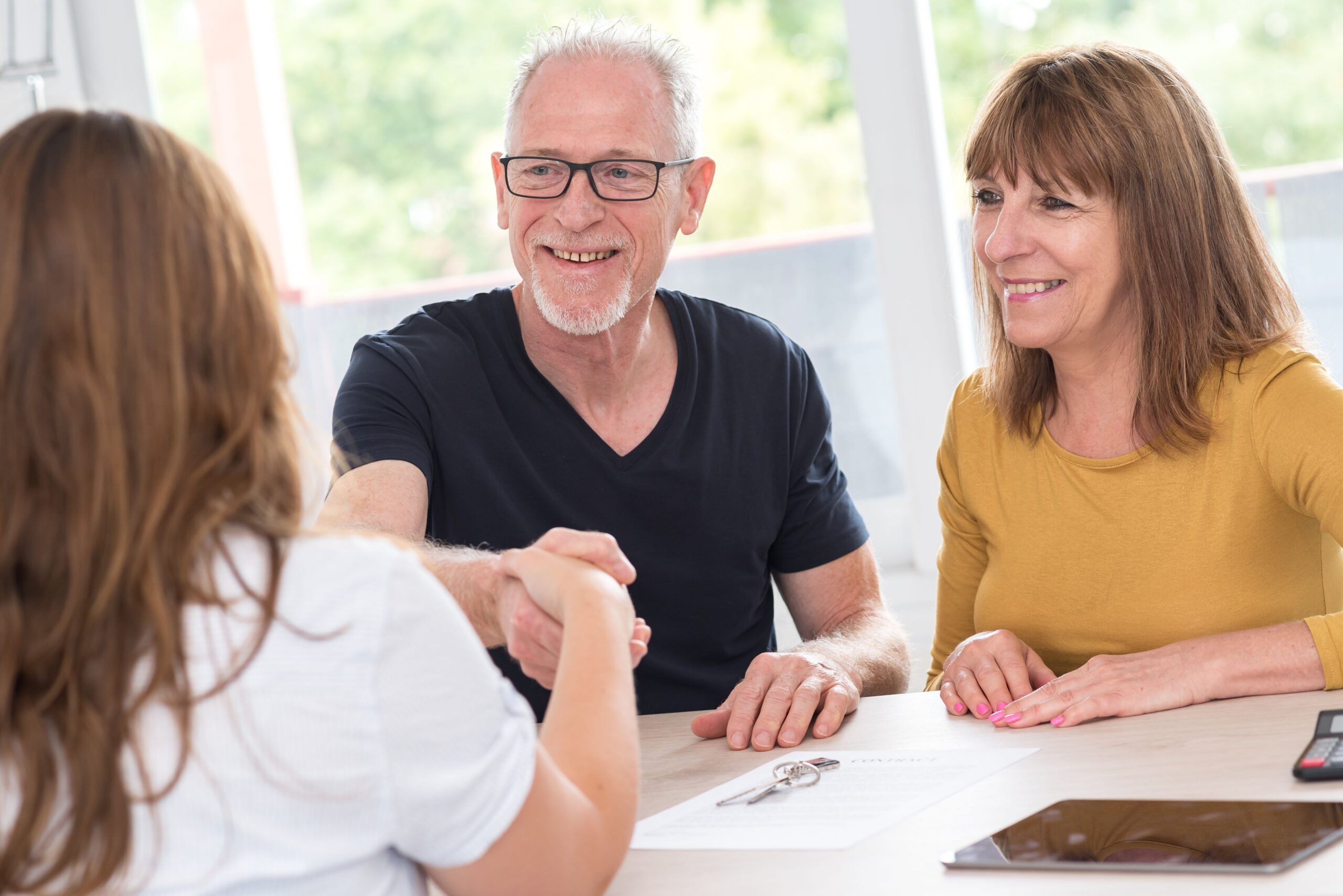 Senior couple meeting real estate agent