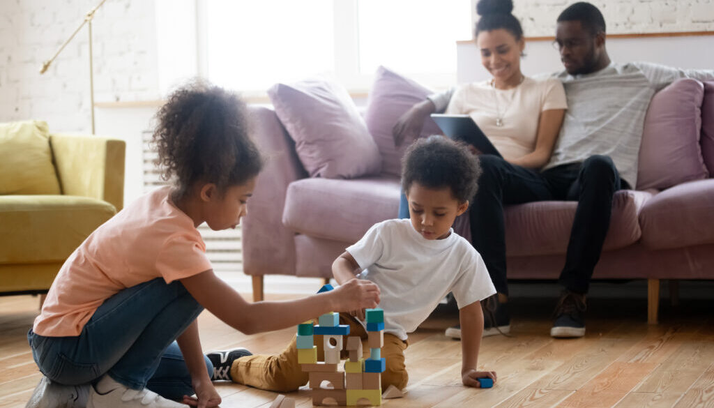 African parents with children spending evening together