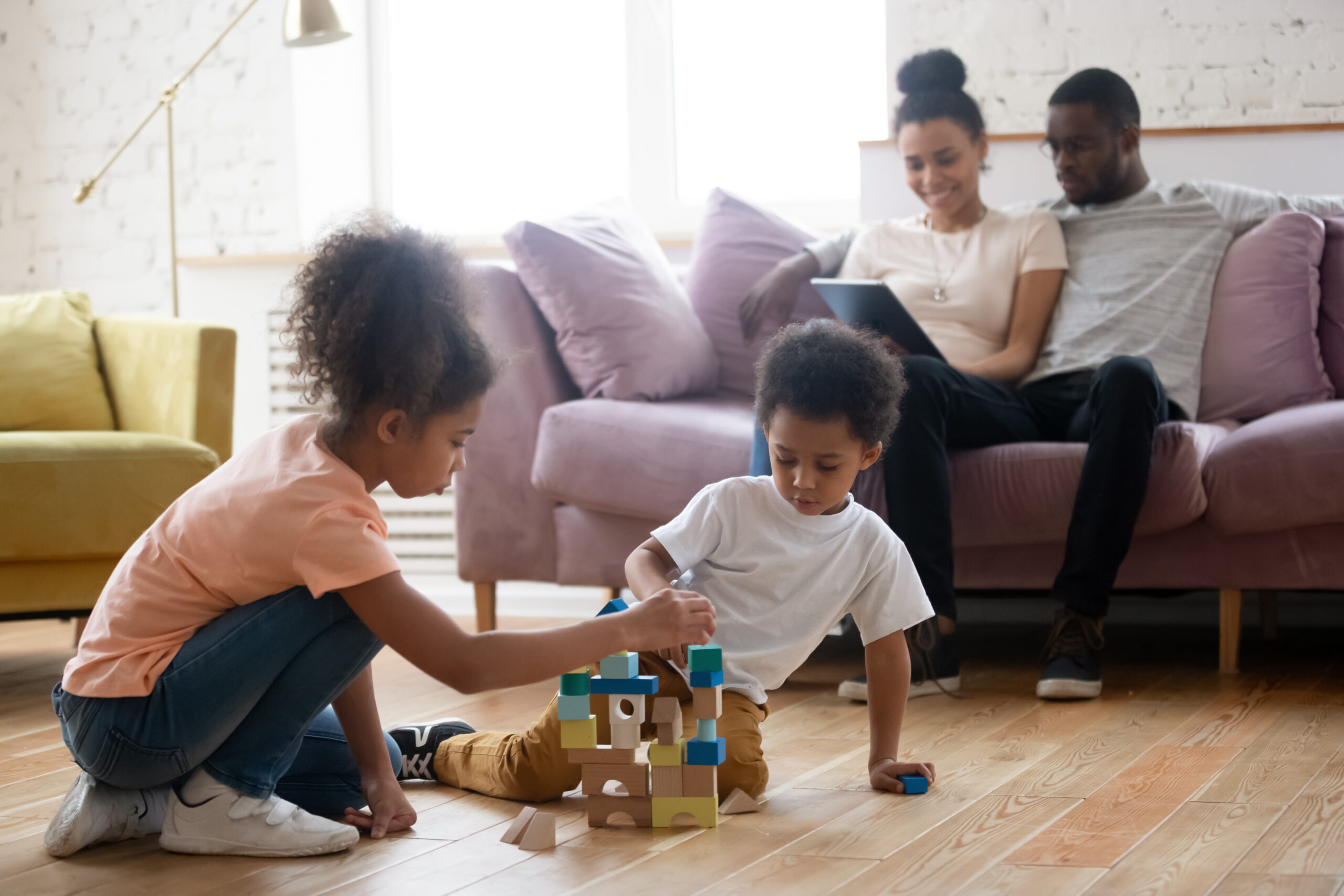 African parents with children spending evening together