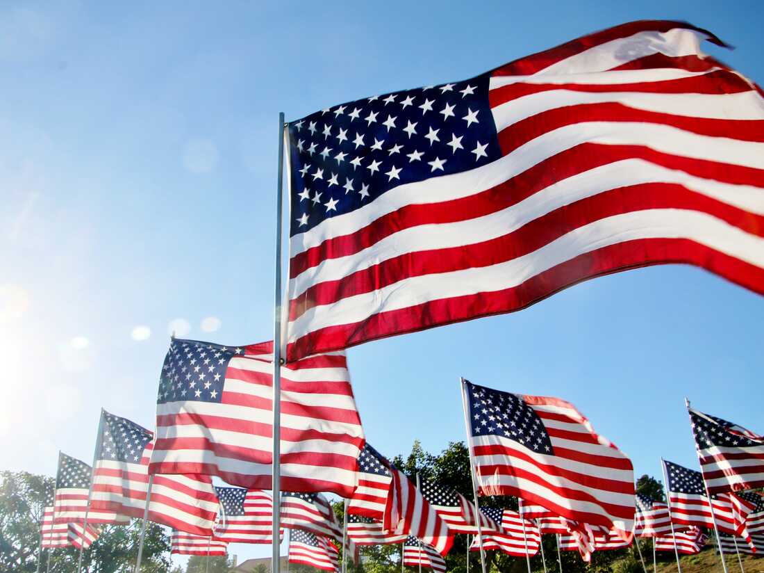 United States flags blow in the wind in Malibu, CA