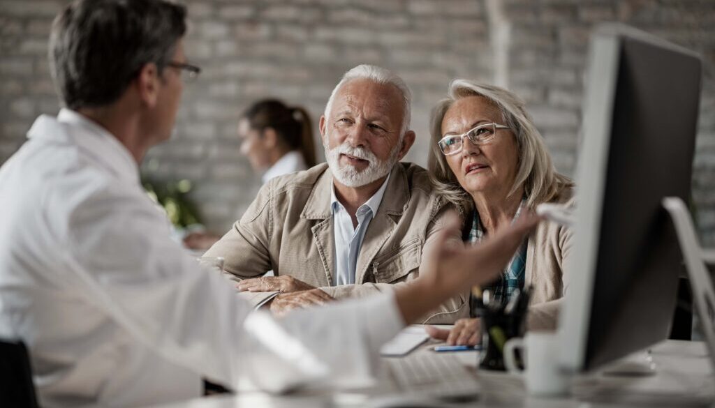 senior-couple-talking-with-doctor-about-their-medical-records-while-having-consultations-clinic SMALL recolor